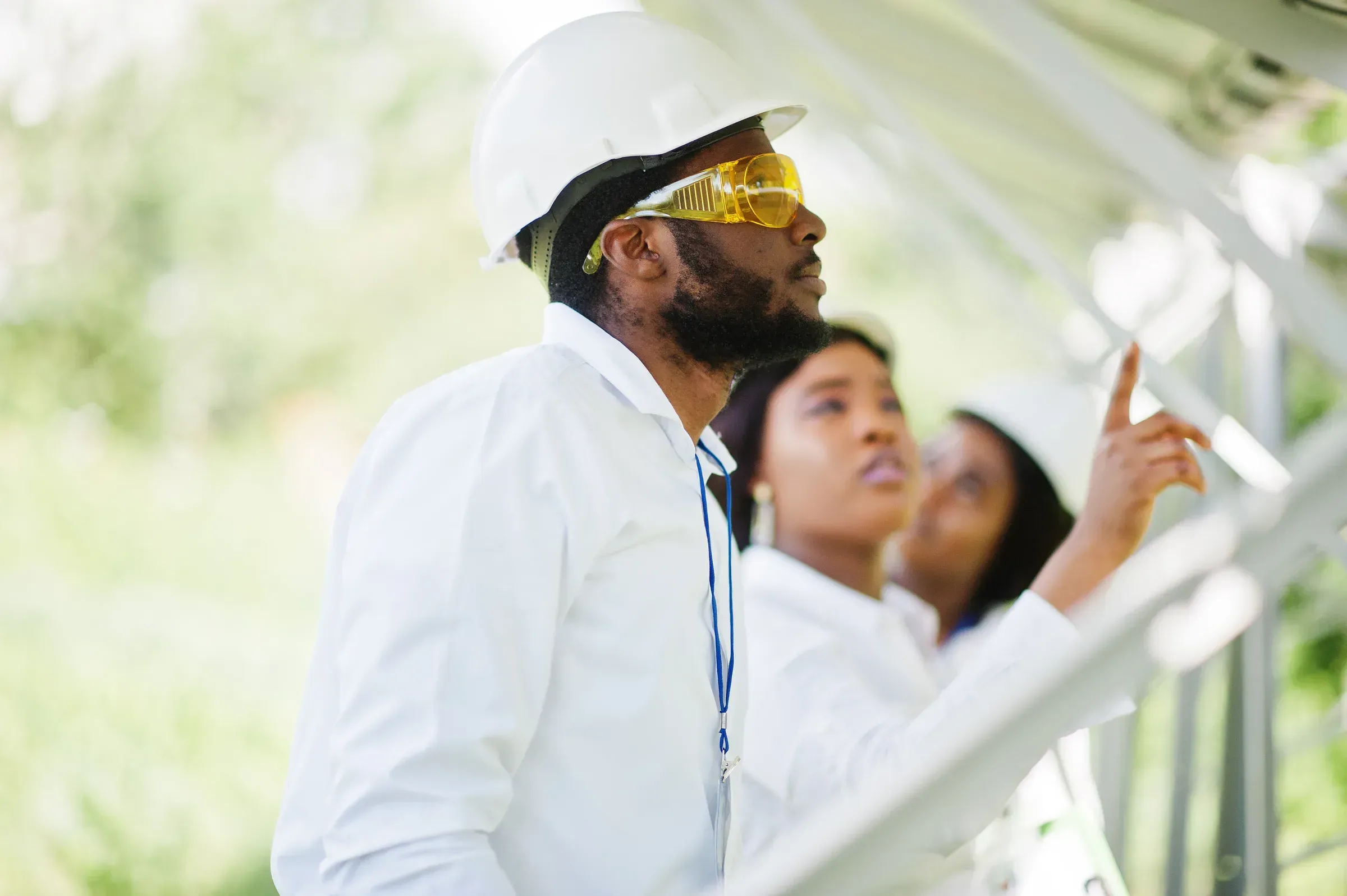Engineers reviewing plans on infrastructure site